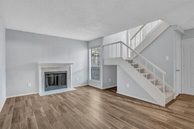 Unfurnished living room with a textured ceiling, a