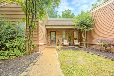 View of exterior entry with covered porch