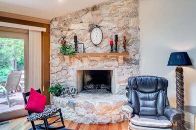 Stone Floor to Ceiling Fireplace in Living Room; G