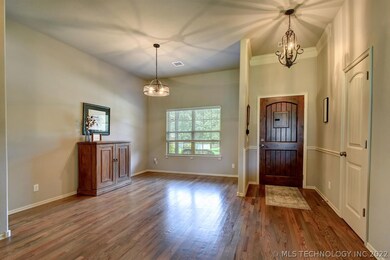 Gorgeous solid hardwood floors flow from the Entry