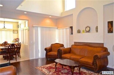 Family room with newer flooring, fireplace and cat