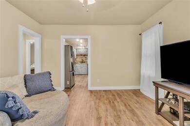 Living room featuring sink and light hardwood / wo