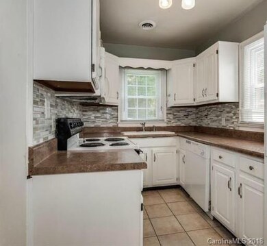 Galley style kitchen with cool backsplash