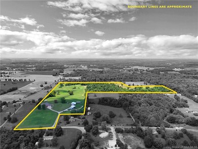 55 acres, several barns, pond
