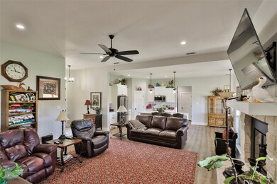 Living room featuring a stone fireplace, luxury vi