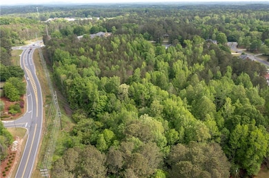 Bird's eye view featuring a wooded view