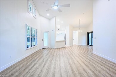 Unfurnished living room featuring ceiling fan with