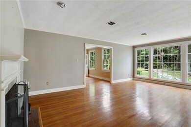 Formal yet comfortable living room with fireplace.