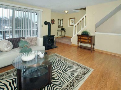 Living Room. Access to charming front balcony from