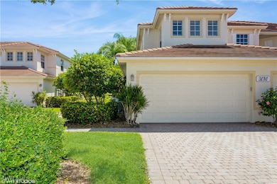View of front of property with a garage, decorativ