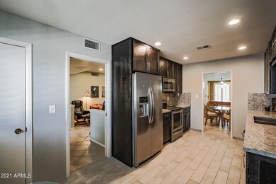 KITCHEN SHOWS ENTR TO LIVING & DINING