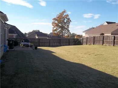 Backyard view with patio.