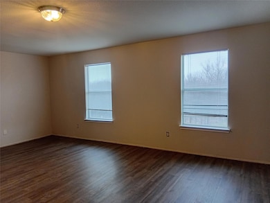 Spare room with plenty of natural light and dark w