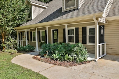 View of exterior entry with covered porch