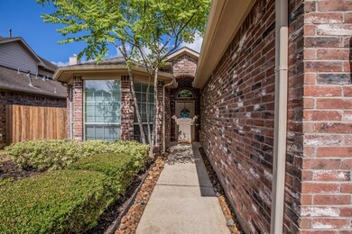 Striking red brick, bay window and beautiful landscape say COME ON IN!