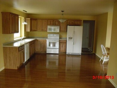 Kitchen Dining room with hardwood flooring and wal
