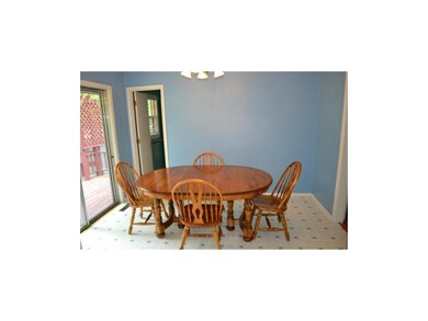 Kitchen offers large eat in area and walk out to t