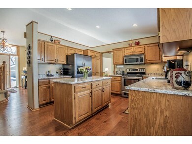 Beautiful hardwood flooring throughout foyer, kitc