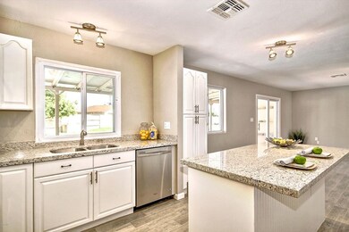Open kitchen overlooks backyard