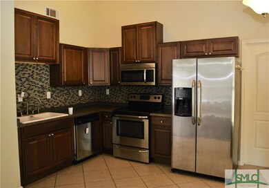 Beautiful kitchen with ceramic tile and stainless 