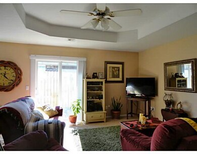 Living Room. Sliding doors open to side yard /back