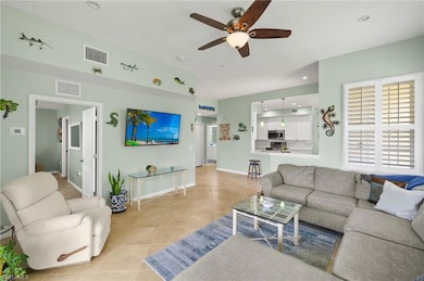 Living area featuring light tile patterned floors,