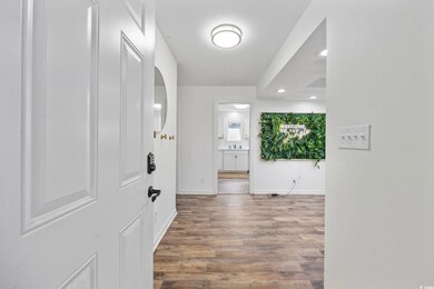 Corridor featuring dark hardwood / wood-style floo