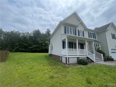 View of front of home featuring covered porch, cra