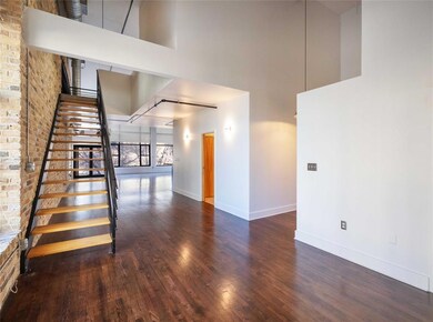 Stairs featuring baseboards, wood finished floors