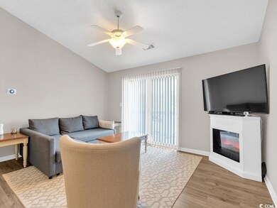 Living room featuring light hardwood / wood-style 