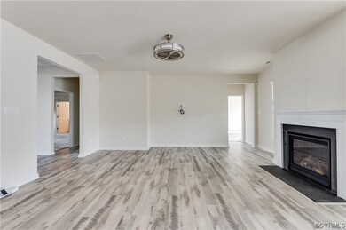Unfurnished living room with light hardwood floori