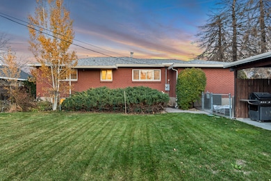 Back of property featuring brick siding
