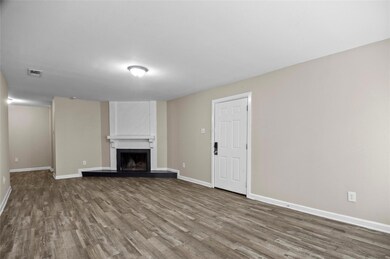 Unfurnished living room featuring vinyl plank floo