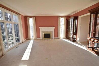 Dining Room with Fireplace and Floor to Ceiling Wi