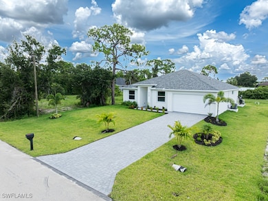 View of front of property with a front lawn, decor