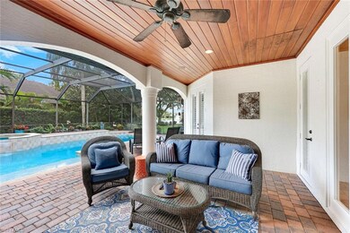 Relaxing outdoor space featuring a well-maintained paver stone pool deck complemented by a charming wood ceiling structure, ideal for enjoying sunny days and cool evenings by the pool.