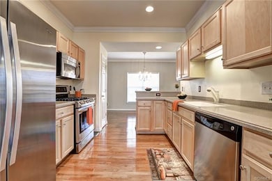 Spacious Galley Style Kitchen with Maple Cabinets,
