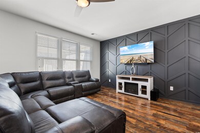 Living room with dark hardwood / wood-style floors