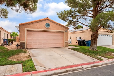 View of front of home with stucco siding, a tiled