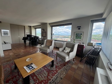 Living Room with 8'X5' Walls of Windows that Open