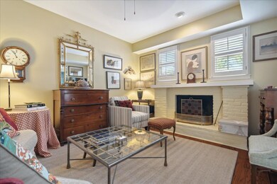 Living area featuring a fireplace and hardwood / w