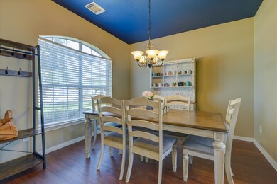 The dining room has abundant natural light and ple