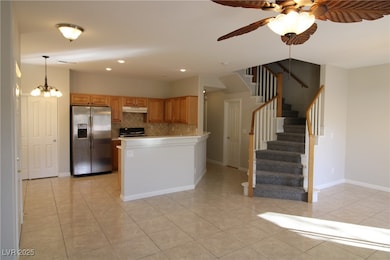Kitchen featuring stainless steel refrigerator wit