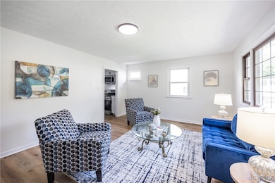 Living room featuring wood finished floors and plenty of natural light