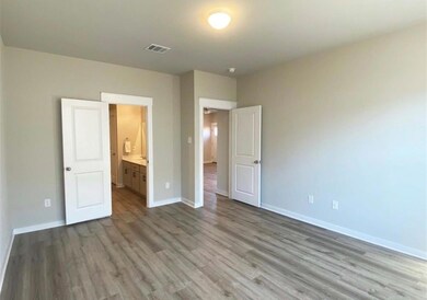 Unfurnished bedroom with wood finished floors and