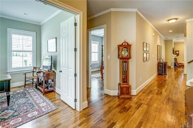 Foyer has hardwood floors and nice moldings.  Offi