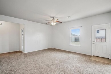 Spare room with carpet flooring and ceiling fan