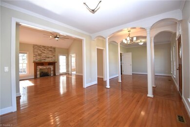 A view from the corner of the keeping area to both the living room and formal dinning area.