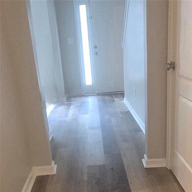 Foyer featuring wood finished floors