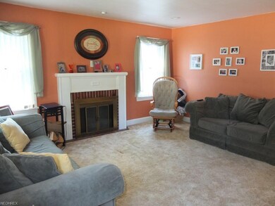 Spacious living room with recessed lighting and a 